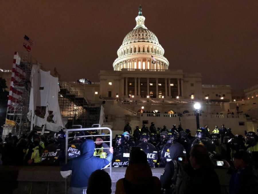 Capitol Police, after a considerable struggle, secure the Capitol as night falls. 