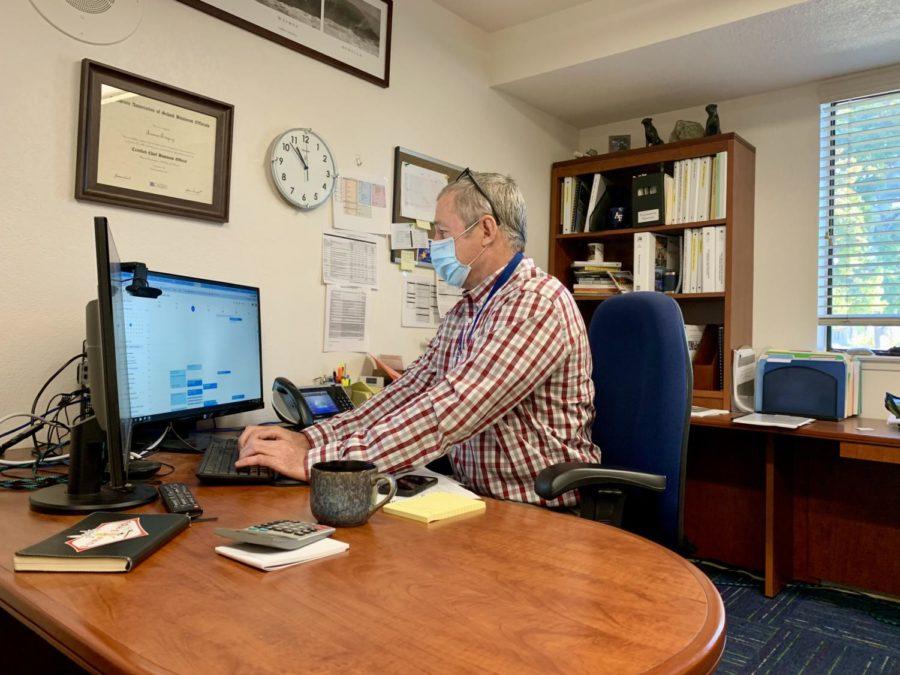 Jim Empey at work in his office. Empey believes that the current challenges brought on by the pandemic have made it harder to be a leader in education than ever before.