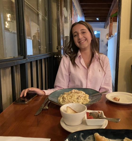 Flavia Bruno sitting down to enjoy a meal from Ginas Italian restaurant in Arroyo Grande.