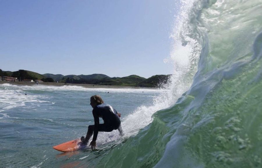 Travis+Nelson+catching+a+wave+at+a+competition+in+Pismo.+