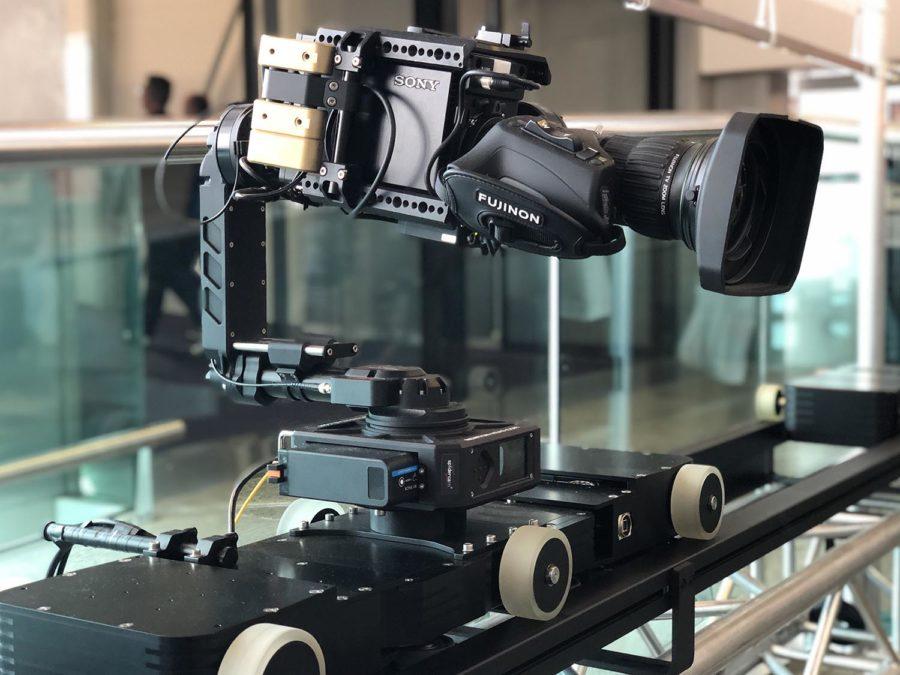 Pictured here is a remote-controlled camera stabilizer mounted on a rail.