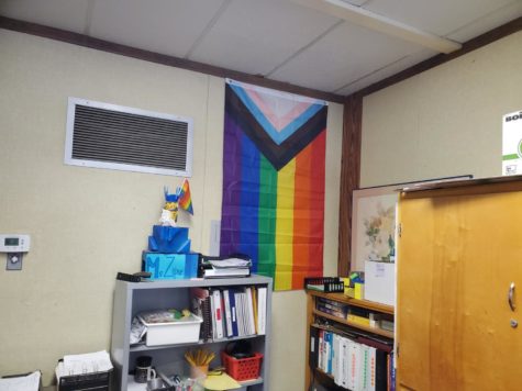 The GSA has many various flags hung up in the room they meet in, including this flag which represents the LGBTQ+ community
