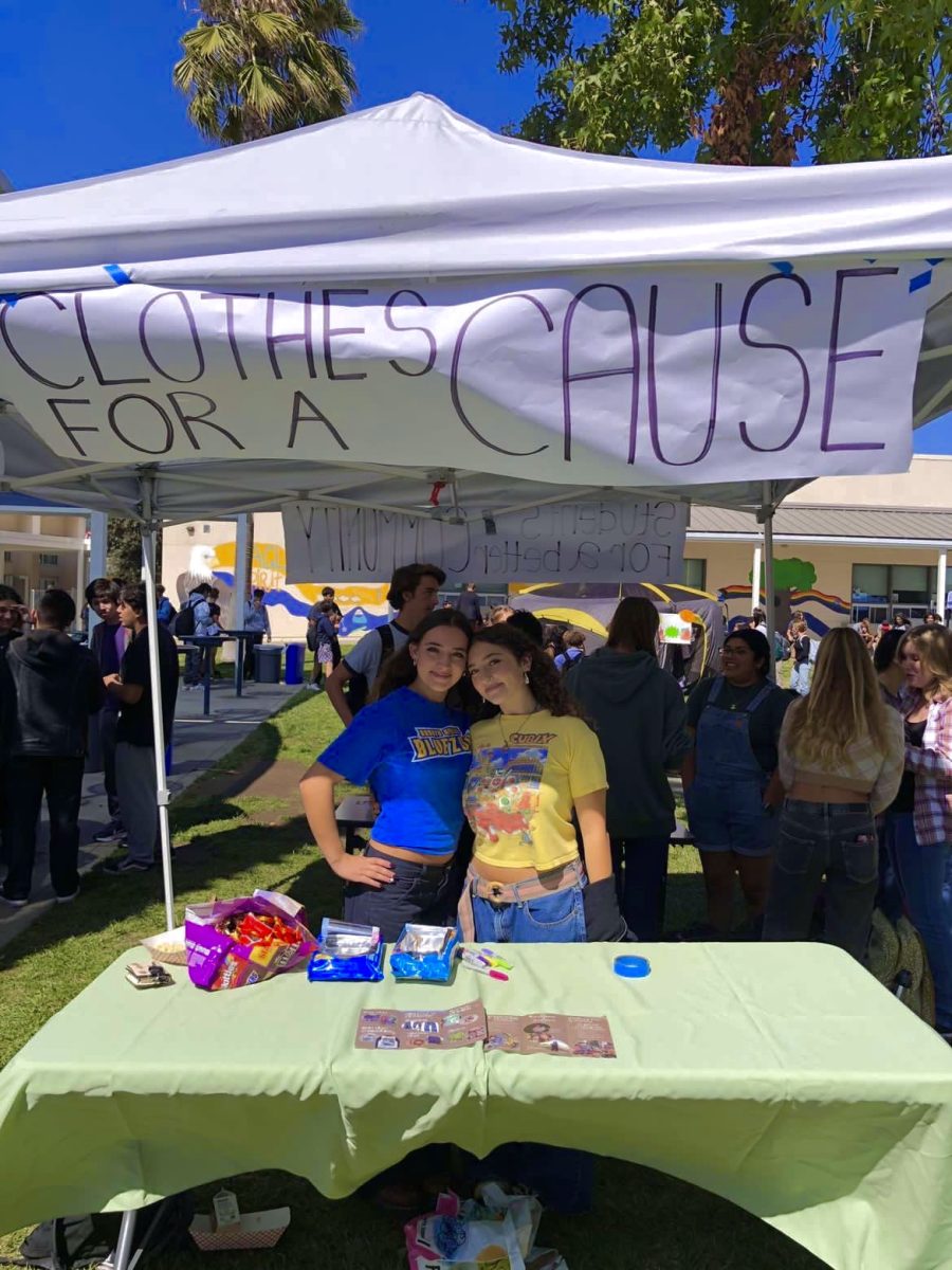 Izzy Levy (24) and Ivy Childers (24) promote their club in AGHSs club fair.