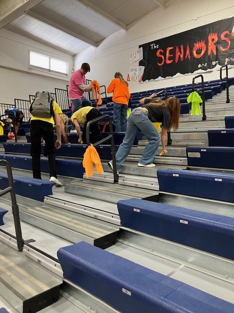 After the rally, students begin cleaning up the stands.