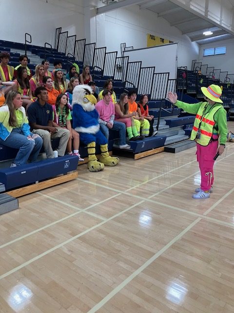 Mrs. Hurtado assigning the leadership team different jobs right after the rally .