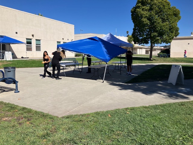 ASB members help take down the tents and tables after lunch. 