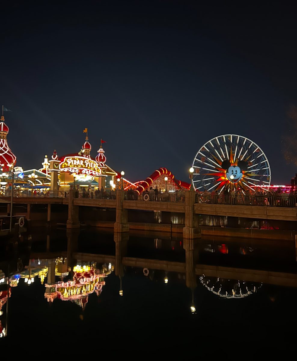 Disneyland's Pixar pier is brightly illuminated each night.