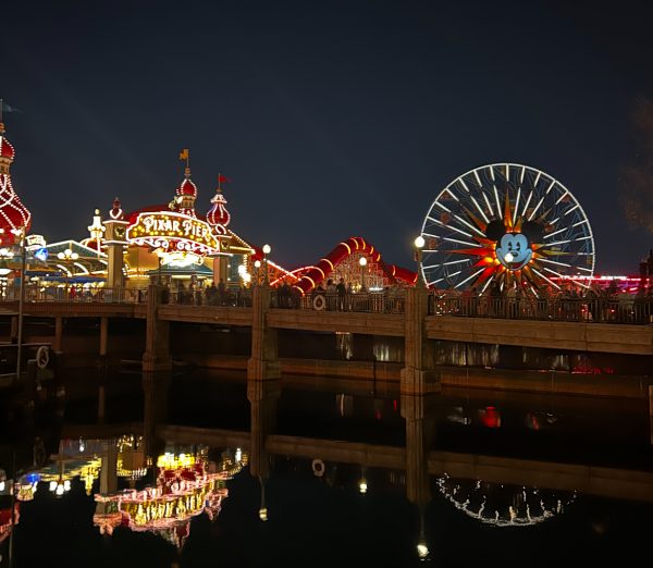 Disneyland's Pixar pier is brightly illuminated each night.