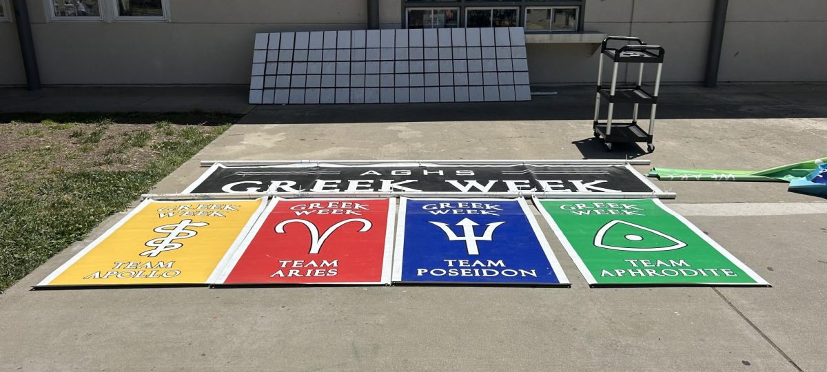 Greek Week banners are mapped out on the ground, and are later hung in the football stadium. 