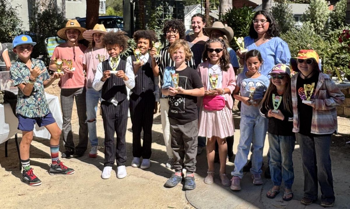 Winners all lined up to take a picture after the event with their trophies.