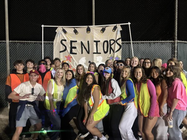 AGHS seniors getting ready to walk their Greek week banner on the track.