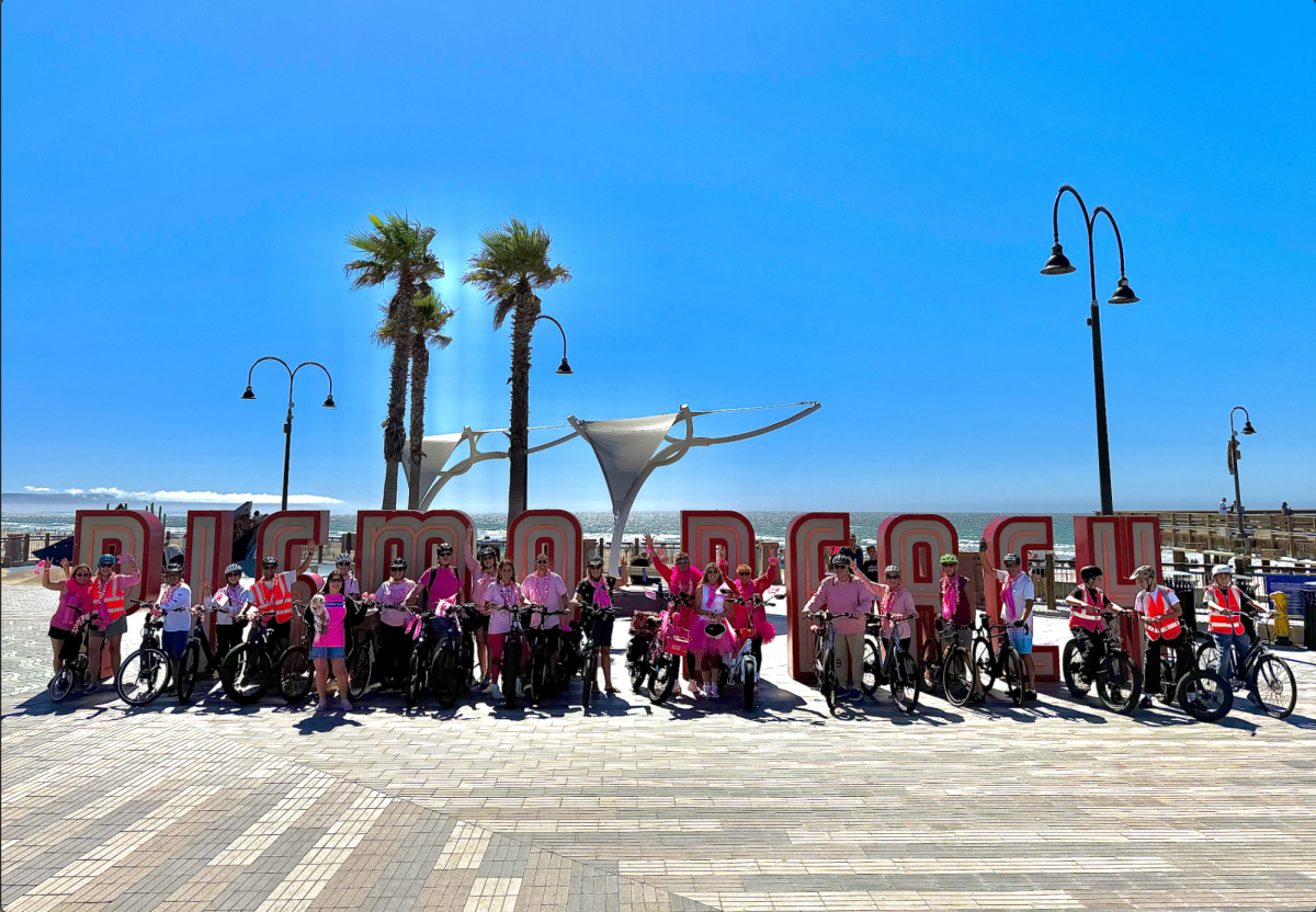 All 25 electric bike riders wore pink to raise awareness for breast cancer. 
