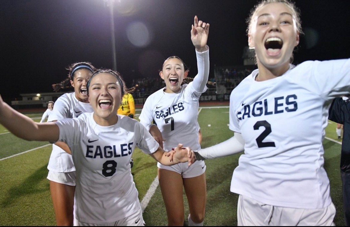 Romero and her team celebrating a victory. 