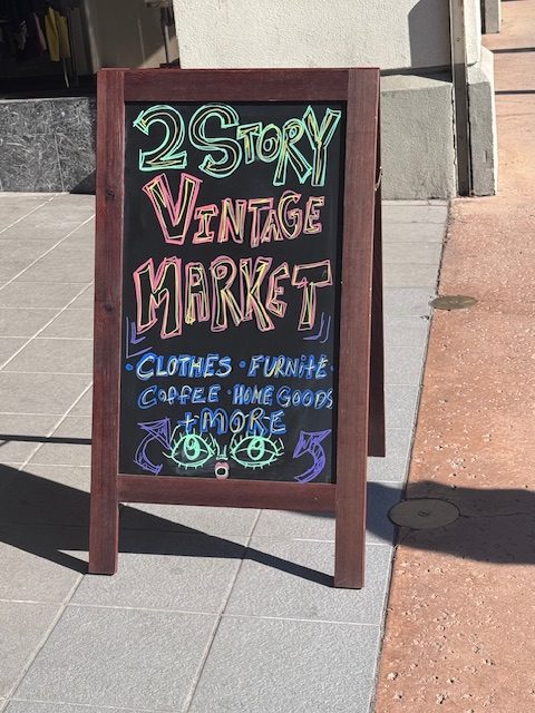 Signs were set around the building to lure people from the streets into the market. 