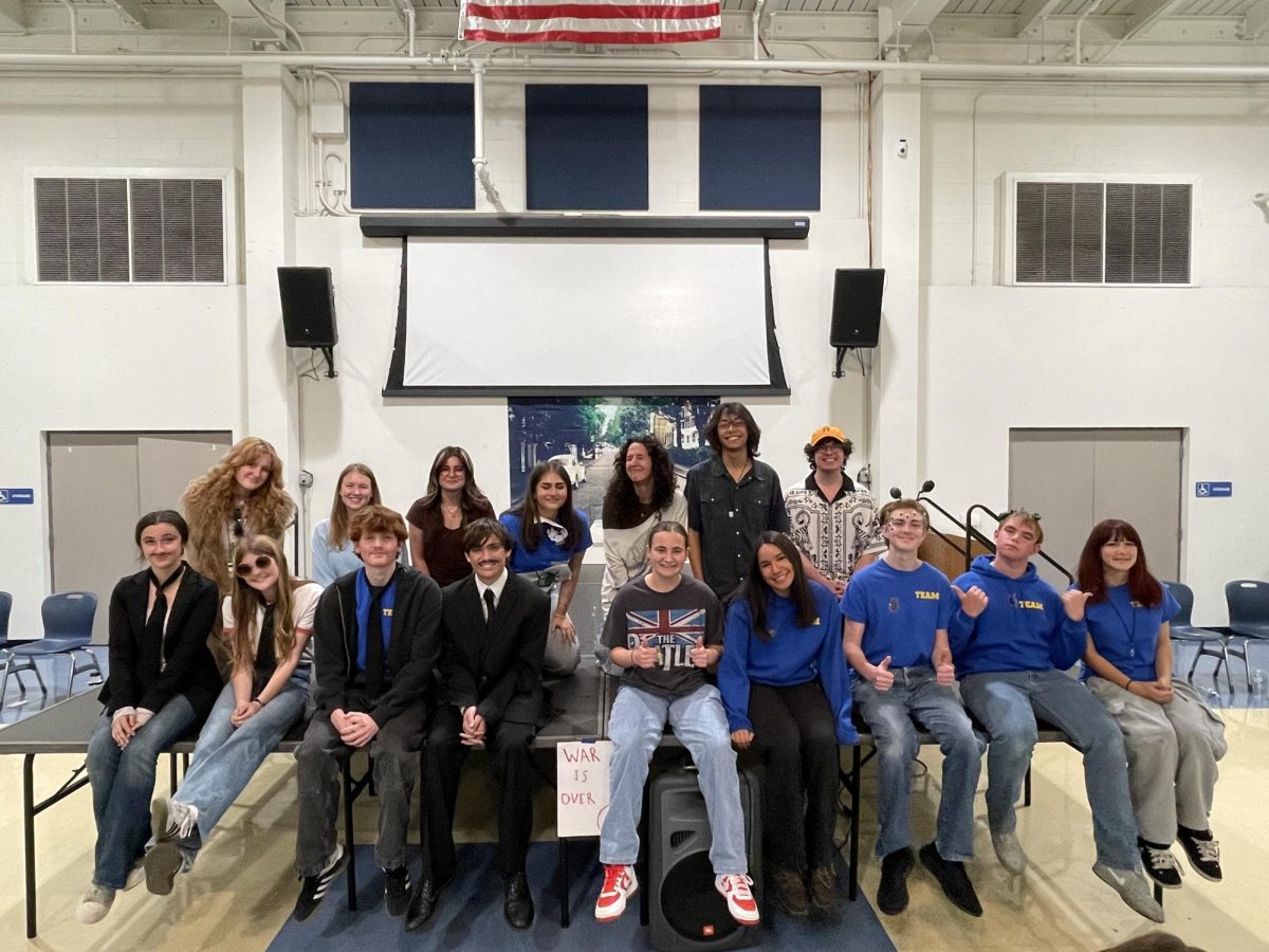 Despite being on separate teams for the day, the improv actors are a large family.