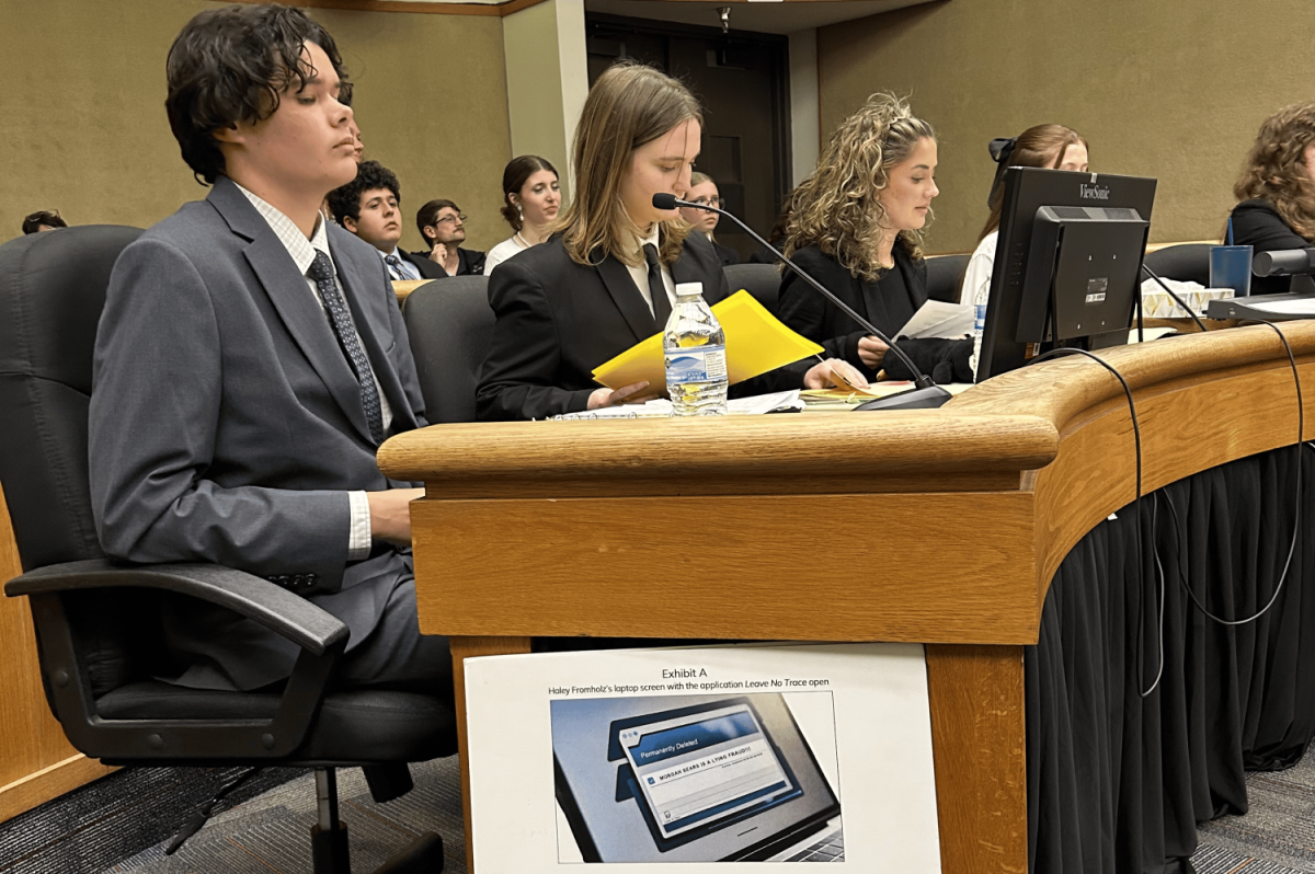 The legal counsel sit and prepare the case. (photo courtesy Belen Lopez) 
