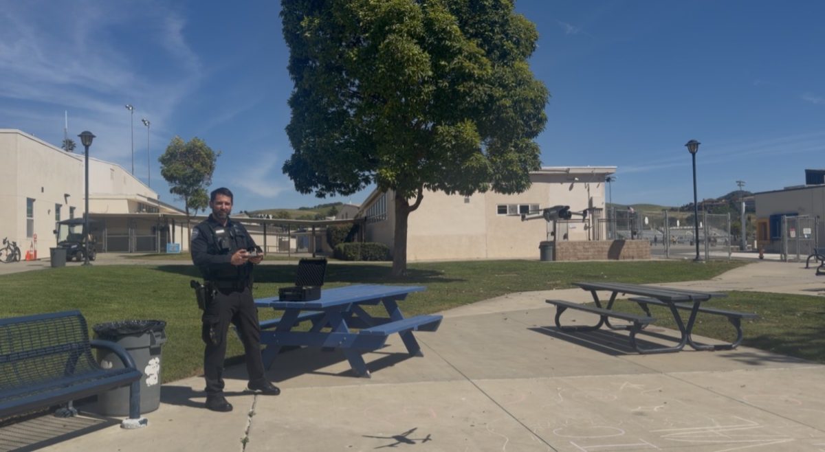 Officer Pullen operating a surveillance drone above the quad at Arroyo Grande high school. 
