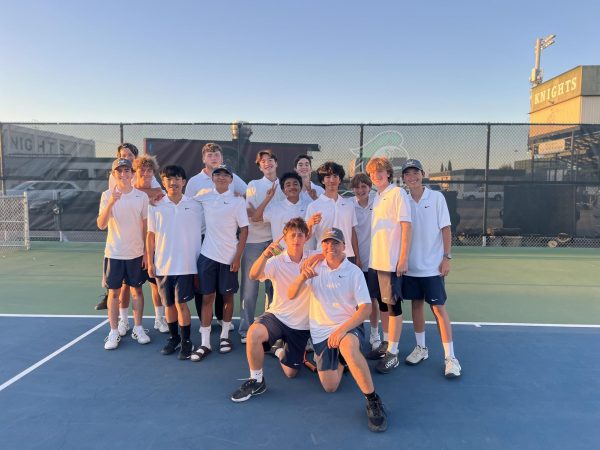 Boys Varsity Tennis team photo after a win.