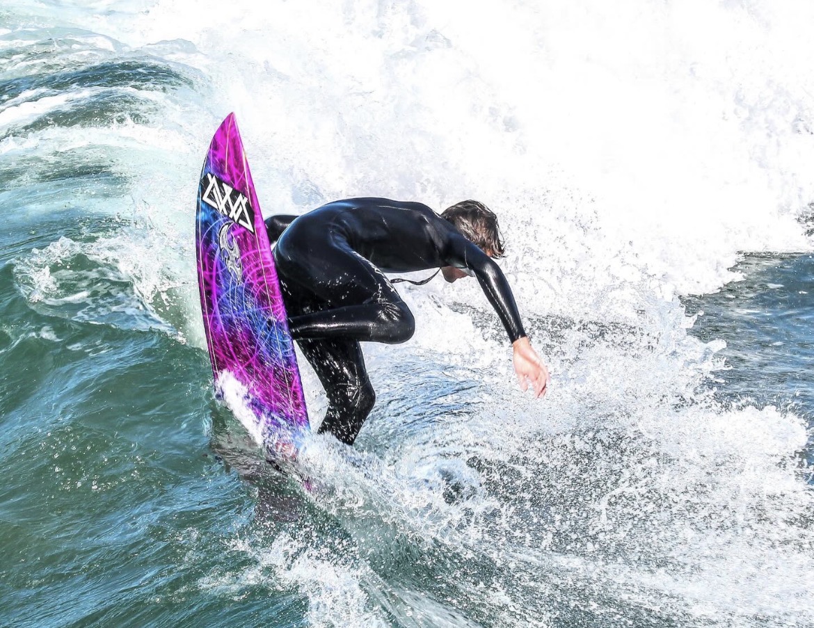 Tracht smashes a lip on a right at the Pismo Beach Pier. 