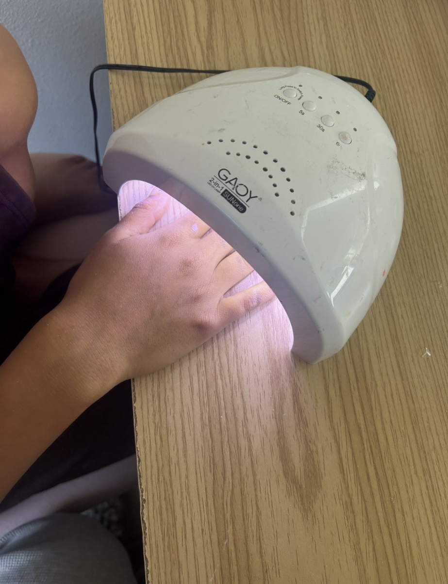 The UV nail lamp cures gel nail polish and locks designs and colors into place.