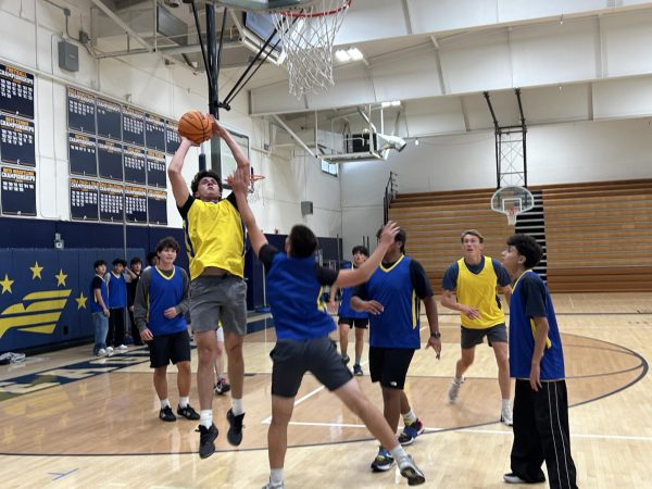 Chase Porter('26) takes mid range jump shot over a defender.