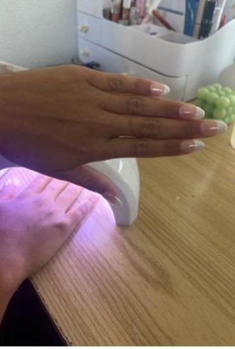 Gibson’s setup for each client enables her to create any design, like a chrome french tip.